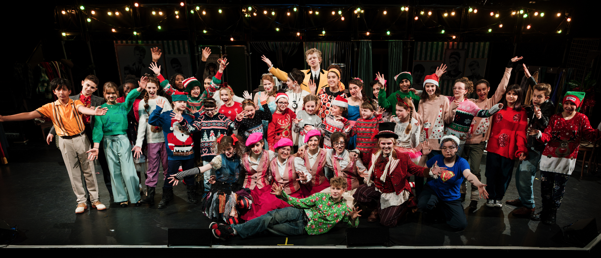 The London Youth Opera company on stage in costume.